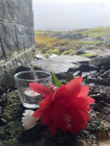 a candle and a flower offering